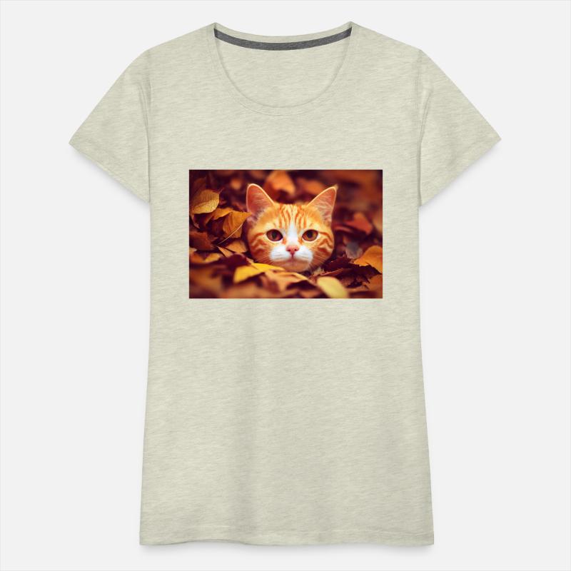 Cat orange and white cat laying a pile of leave